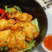 Golden Wings · Breaded chicken wings, deep-fried and served with a sweet Thai chili dipping sauce