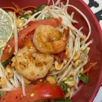 Green Papaya Salad (Som Tum) (Spicy) · Julienne crispy papaya, fresh vegetables, shrimp and peanuts served with a spicy lime dressing