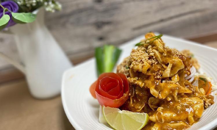Bangkok Peanut Noodles · A delightful dish of thin Rice noodles, with chicken (can substitute with beef or pork), fresh cut Napa cabbage served with a creamy peanut sauce garnished with fried crispy shallots and cilantro