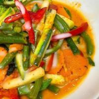 V-E5. Pad Panang (Vegan) · Tofu stir-fried with string beans, bell peppers and carrots in a Red curry, topped with shre...