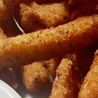 Zucchini Sticks · Zucchini breaded and deep fried to a golden brown. Served with ranch dressing,