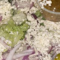 Greek Salad · Most popular.Field greens, tomatoes, cucumbers, onions, feta cheese, pepperoncini, kalamata ...