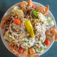 Mediterranean Shrimp Salad · Grilled shrimp, field greens, tomatoes, cucumbers, artichoke hearts, onion, feta cheese, pep...