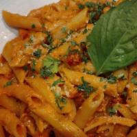 Penne Vodka Dinner · Sun-dried tomatoes in a spicy creamy vodka rose sauce and topped with Parmesan.