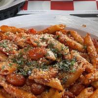 Penne Arrabiata Dinner · Penne pasta, fresh basil, spicy marinara topped with Parmesan.