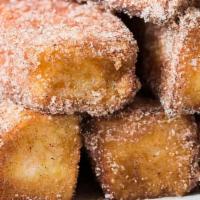 Cinna-Stix · Deep fryed dough with cover in cinnamon sugar. Served with 6 peices.