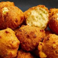 Hushpuppies · Hushpuppies Served with 10 pieces. Served with marinara sauce.