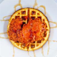 Chicken And Waffles · Breakfast at any time! Double dredged, buttermilk fried chicken thigh on top of a golden bro...