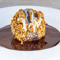 Peanut Butter Explosion · peanut butter ganache and chocolate mousse inside a chocolate shell and caramel drizzle (GF)