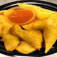 Cheese Fried Wontons 起士云吞 · Cheese, crab meat and onion with a bit of sweet sauce. Served with plum sauce.