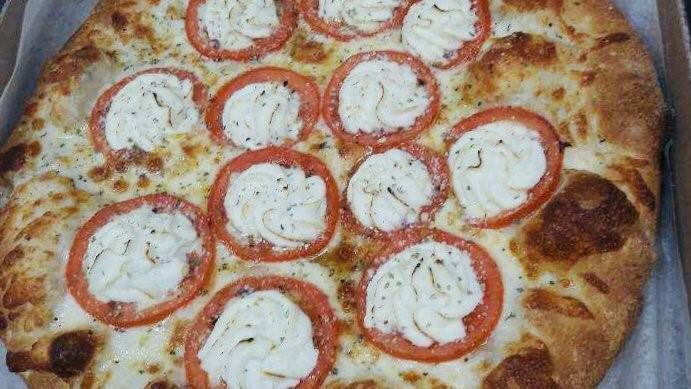 White Pizza (12 In.) · Our fresh dough with special garlic sauce, ricotta, and tomato.