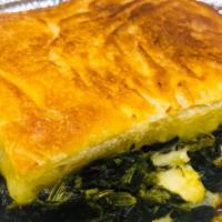 Homemade Spinach Pie · Served with a side of tzatziki sauce.