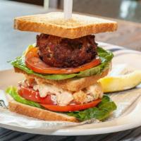 Conrad'S Seafood Club · Fried MD jumbo lump crab cake, shrimp salad, lettuce, tomato, toasted white