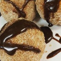 Nutella Arancini · (3) lightly fried sweet rice balls stuffed with nutella, tossed in cinnamon & sugar, served ...