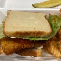 Fried Lake Trout Sandwich · A generous portion of fried lake trout served with pickle and chips can substitute for fries...