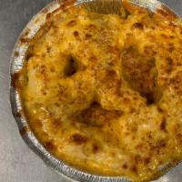 Crab Pretzel · Soft Pretzel covered in crab dip and topped with cheddar cheese