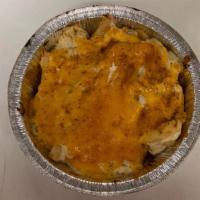 Crabby Fries · French fries topped with crab dip and covered in cheddar cheese