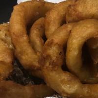 Onion Rings · Cuts of onion beer battered and deep fried