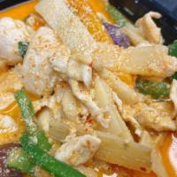 Red Curry · Hot. Cooked with bamboo shoots, string-bean, eggplant, pepper and fresh basil leaves in coco...
