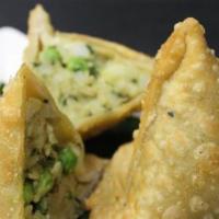 Vegetable Samosa (2 Pieces) (Vegan) · A popular Indian snack, triangular pastry stuffed with potatoes, and peas, with a hint of sp...