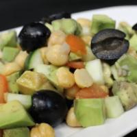 Avacado And Garbanzo · Avacado and garbanzo tossed with the chef’s special house dressing.