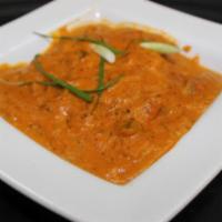 Chicken Tikka Masala · Chicken breast cubes skewered in tandoor and simmered in tomato, onion cream with cashew nut...