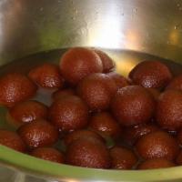 Gulab Jamun · Cheese and flour dumplings, fried to golden perfection and served warm in thick sugar syrup.