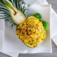 Pineapple Fried Rice · With fresh pineapple, cashew nuts, egg, raisin, onion, carrots, scallion. Choice of chicken,...