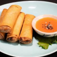Veggie Spring Rolls · Thai crispy spring rolls with vegetables & mung bean noodle stuffing, sided with sweet & sou...