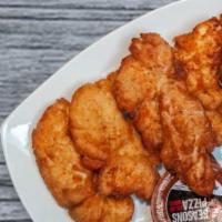 Chicken Tenders · Homemade chicken tenders with a dipping sauce.