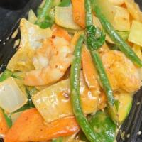 Thai Red Curry · Spicy. Medium spicy red curry paste boiled in coconut milk with pepper onion carrot, string ...