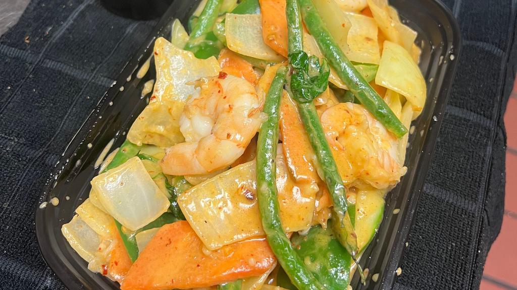 Thai Red Curry · Spicy. Medium spicy red curry paste boiled in coconut milk with pepper onion carrot, string beans, zucchini, and fresh basil leaves.