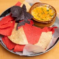 Maryland Crab Dip · Topped with melted Cheddar served with fresh tortilla chips.