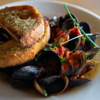 Mussels Fradiavola · Spicy marinara, garlic crostini